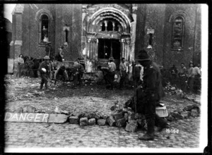 New Zealand Pioneers filling in a mine crater outside a church, World War I