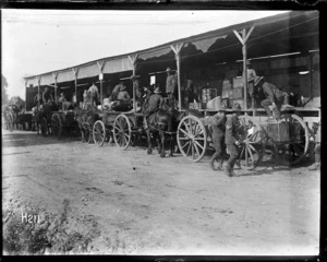 Soldiers and carts at the NZASC ration dump, Steenbecque France