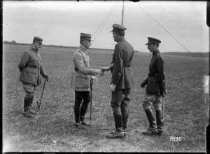 The chiefs of the French and Belgium missions meet on the review ground