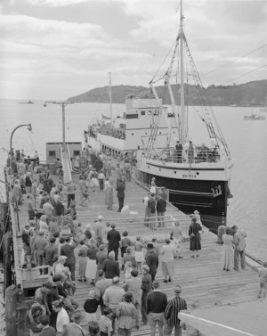 People on the wharf at Oban, Half Moon Bay, Stewart Island, meeting the 'Wairua' - Photograph taken by K V Bigwood