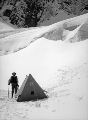 Yunnan, China. Fraser Ratcliffe and small Everest tent at glacier camp. 1 November 1938.