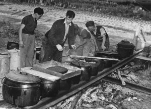 Men cooking outdoors, probably at the centenary celebrations for Rangiatea Church in Otaki