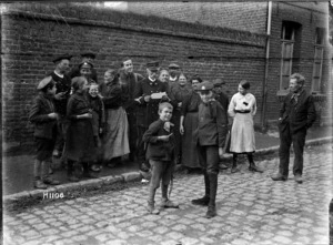 The town crier reads news of Allied victories in Solesmes, France, World War I