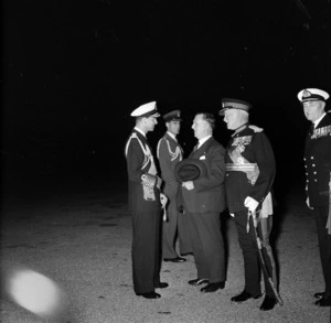 The Duke of Edinburgh in naval uniform talking to Sid Holland, Prime Minister of New Zealand