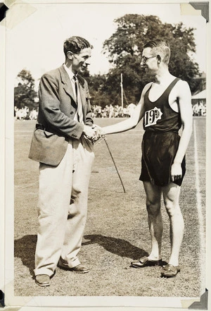 Photograph of Jack Lovelock congratulating Sydney Wooderson after Wooderson had beaten Lovelock's British mile record