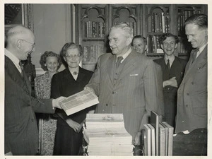 Parliamentary Librarian receiving a gift from Canada