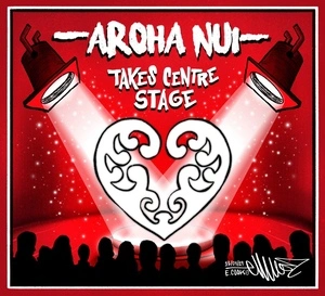 Two spotlights fall on a ponga fern heart on a red stage as "Arohanui" takes centre stage at the Your Are Us Aroha Nui concert