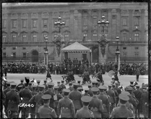 A Highland pipe band marching past Buckingham Palace after World War I