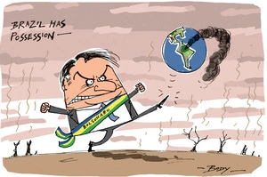 Jair Bolsonaro "has possession" of a smoking Earth soccer ball and kicks it on a burnt field while the Amazon forests are on fire
