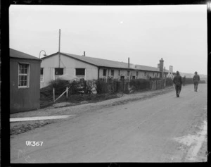 World War I soldiers strolling along a road outside a camp in England