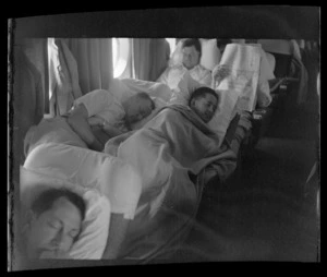Passengers, some who are sleeping, on board Pan American World Airways (Pan Am) Polar Flight between San Francisco and London