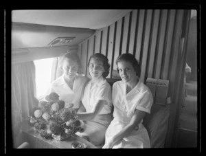 Air hostesses with flower arrangement, Pan American World Airways (Pan Am) Polar Flight between San Francisco and London