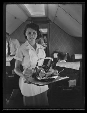 Air hostess with food service hamper on board Pan American World Airways (Pan Am) Polar Flight between San Francisco and London