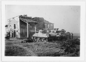 Tanks by a building in the Massa Lombarda area , Italy, during World War II - Photograph taken by W K Lloyd