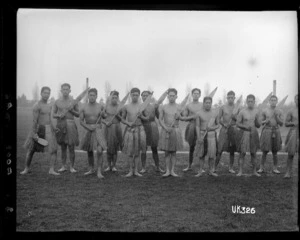 Maori World War I soldiers wearing piupiu and holding hoe, England