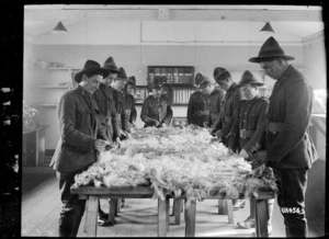 Sorting wool fleeces at a NZEF camp in England