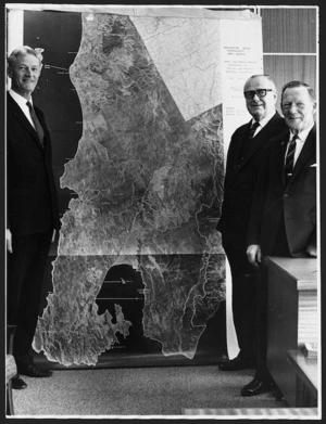 Members of Local Government Commission with huge aerial map