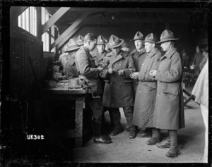 Soldiers examining pistons at a camp in England