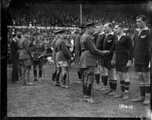 King George V congratulates the New Zealand team at the inter services rugby championship final, London