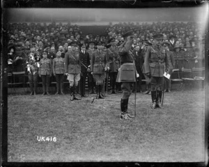 King George V saluting at the inter-services rugby tournament final, London