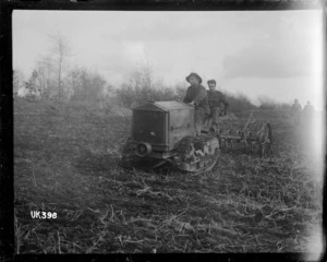 Tractor pulling a hoeing machine, England