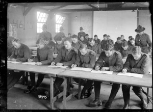 New Zealand Rifle Brigade soldiers sitting an examination, England