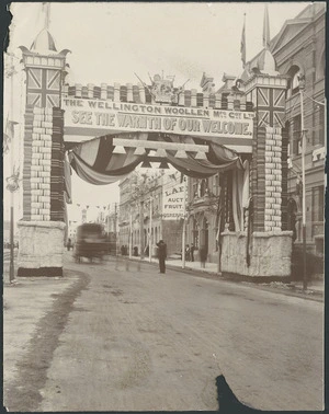 Decorative triumphal arch in Jervois Quay, Wellington, built for the Wellington Woollen Manufacturing Co Ltd for the 1901 visit of the Duke and Duchess of Cornwall and York - Photographer unidentified