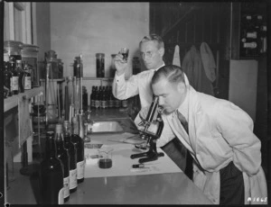 Scientists examining wine at the Department of Agriculture's viticultural research station at Te Kauwhata, Waikato