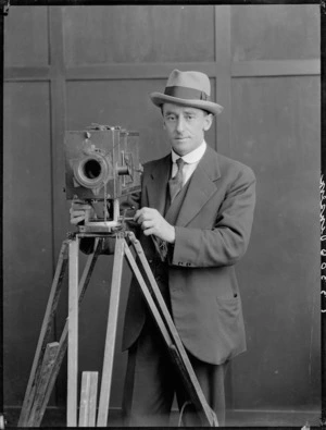 J S Vinsen with a motion picture camera