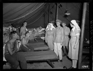 Officers and nurses meeting with World War II soldiers in the Pacific