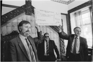 Employment Minister Kerry Burke handing a government cheque for one million dollars to the Board of Maori Affairs - Photograph taken by Ian Mackley