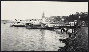 TEAL air terminal with Solent flying boat in pontoon dock, Evans Bay
