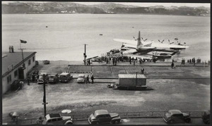 TEAL air terminal with Solent flying boat in pontoon dock, Evans Bay