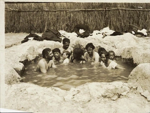 Group of unidentified Maori in a hot pool, possibly in Rotorua