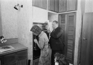 Prime Minister Robert Muldoon, and his wife Thea, in the kitchen of Vogel House, Lower Hutt