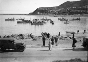Boats setting out to sea at Island Bay for four fishermen's funerals
