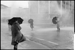 People with umbrellas in artificial rain, Wellington, New Zealand