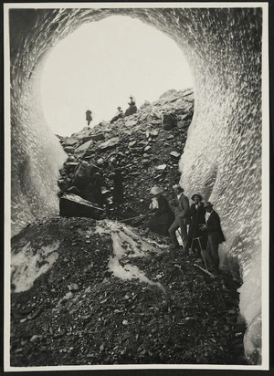 Group standing in an ice cave, Mueller Glacier