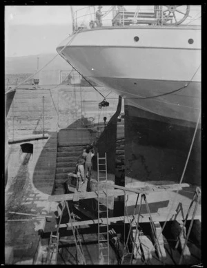 Men on scaffolding working on an unidentified ship in Lyttelton drydock, Godley Quay, Lyttelton