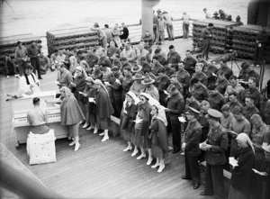 World War II troops and nurses at a church service on board the New Zealand transport Nieuw Amsterdam