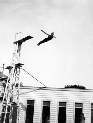 W B Olds diving off a board