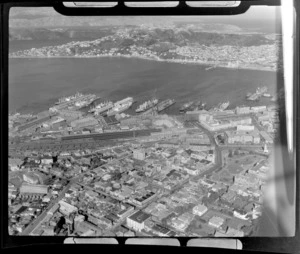 View of the suburb of Thorndon and the Houses of Parliament with Wellington Railway Station and Harbour to Mt Victoria beyond, Wellington City