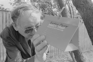 Dave Kershaw inspects an Asian gypsy moth trap - Photograph taken by Mark Coote