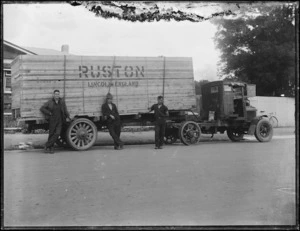 Men by a truck labelled Ruston Lincoln England