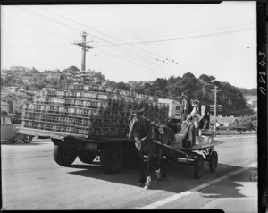 Empty milk bottles being loaded onto a truck from a cart - Photograph taken by Mr Wilson
