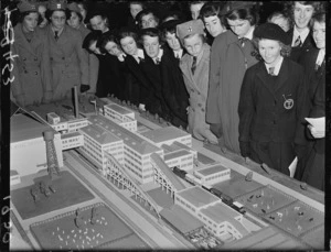 Schoolgirls study model of building