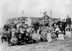 Pupils and teachers alongside the flag pole at Roseneath School, Wellington