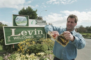 Levin liquor store owner David Max rips up the Listener magazine that calls Levin the most boring town in New Zealand - Photograph taken by Phil Reid