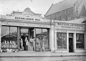 Shop fronts of the businesses of Geo R Taylor, general merchant, and Watson & McIntosh, ironmonger, Tees Street, Oamaru