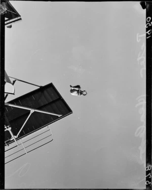 Diver Peter Healey mid-air above the high board, 1950 British Empire Games, Auckland
